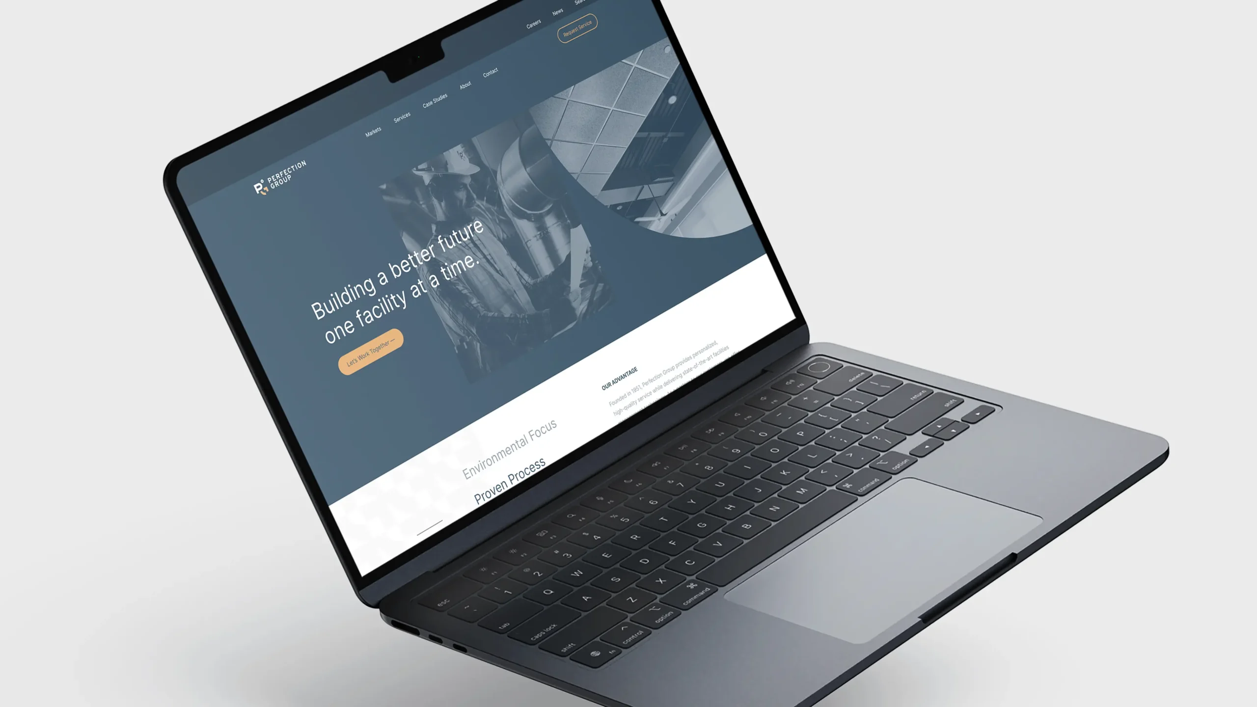 Perfection Group website design mocked up on a modern laptop